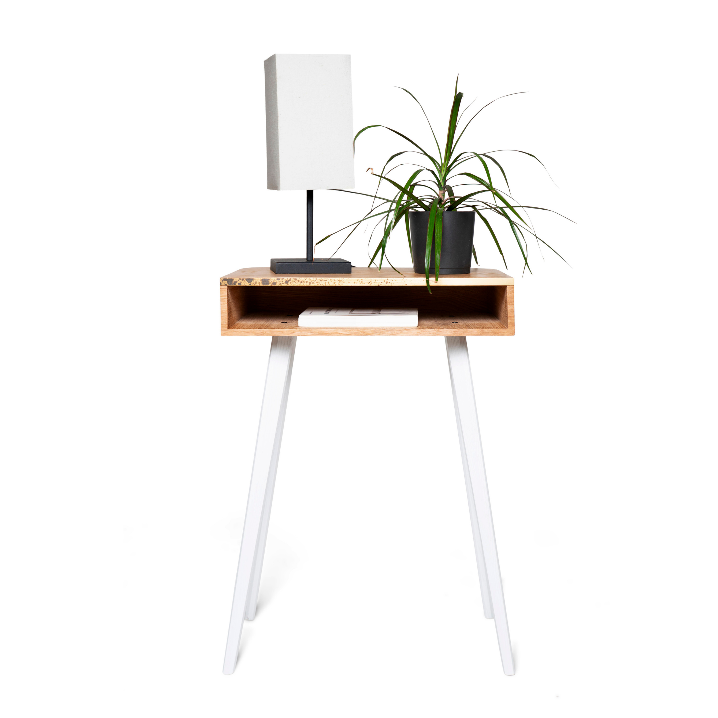 Front view of rectangular wooden nightstand with brass design and white wooden legs